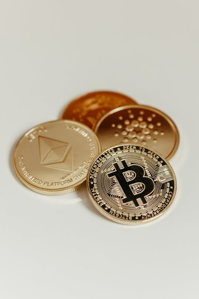 our-story Elegant display of Bitcoin, Ethereum, and Cardano coins on a neutral background.